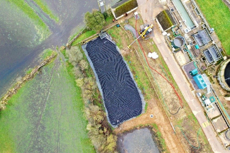 Drone view of water storage site with shade balls